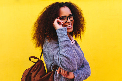 Female traveler looking away and smiling