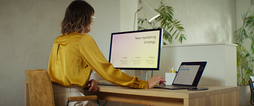 Business executive working on marketing strategy at her desk