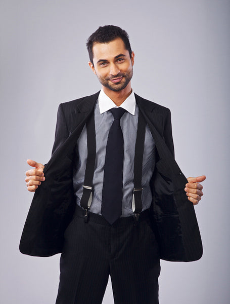 Cheerful Young Professional Holding Open His Coat