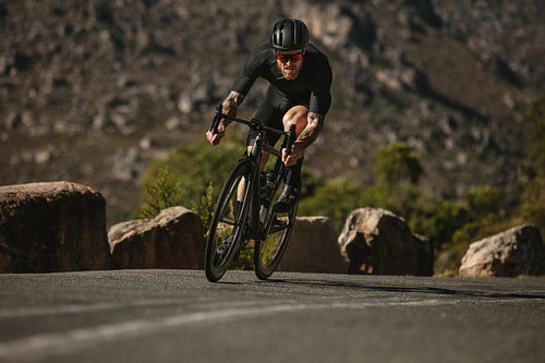 Cycling through curvy mountain road