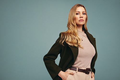 Middle aged woman standing in a studio