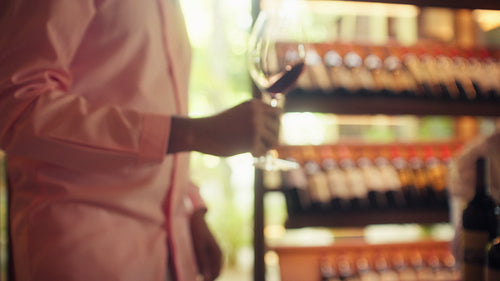 Sommelier guides friends through a luxurious private wine tasting experience in an elegant cellar