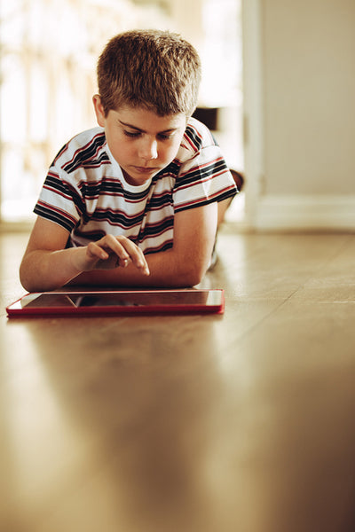 Kid playing games on a tablet pc
