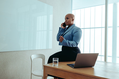 Confident African-American business woman on a phone call