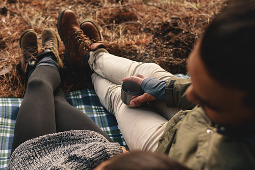 Hikers relaxing on mountain slope