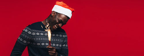 Man celebrating christmas with firework