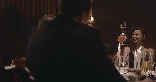 Friends celebrating with wine at party