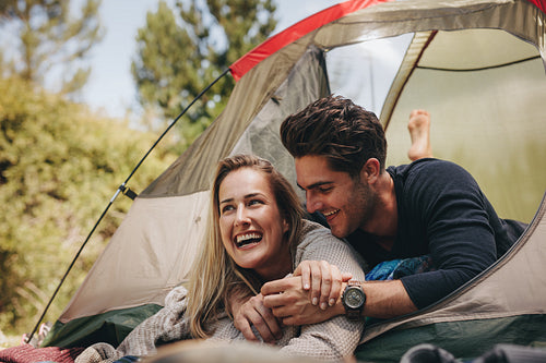 Loving young couple camping in nature