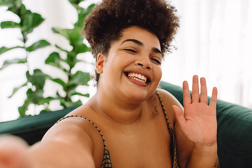 Attractive smiling woman taking selfie