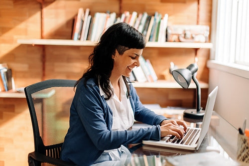 Smiling woman working in her home office