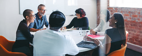 Cheerful businesspeople smiling during a meeting