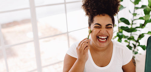 Smiling woman doing her self care routine