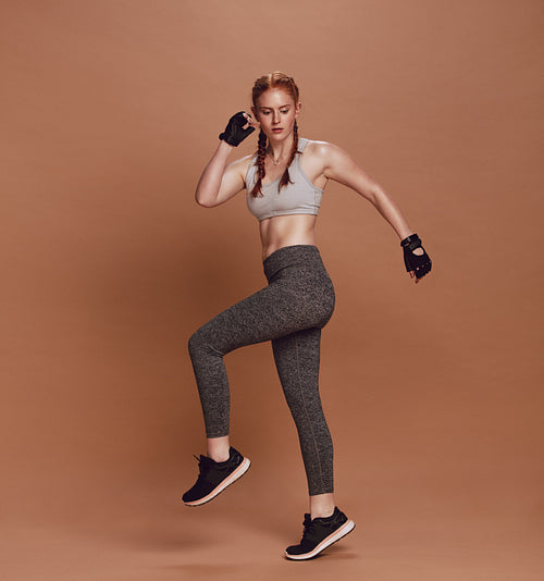 Woman doing aerobics in studio