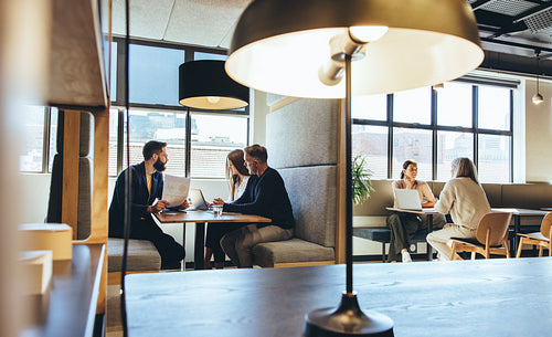 Businesspeople working in a modern co-working space