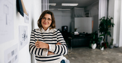 Her furniture design review happens beside a material board in the studio