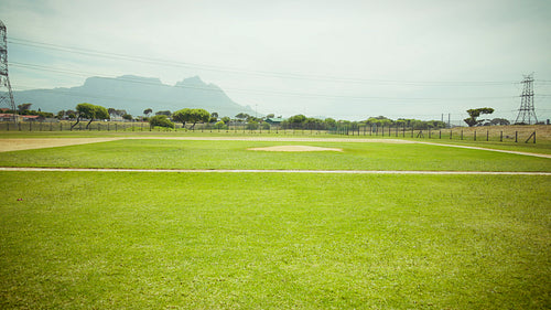 Pitcher practices throwing on the baseball field