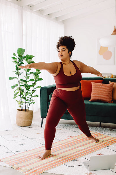Plus size female exercising at home