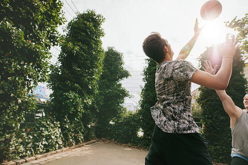 Friends playing basketball and having fun