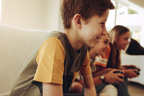 Kids playing video games at home