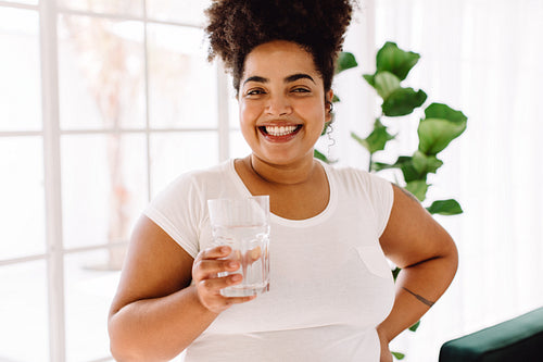 Beautiful woman with glass of water