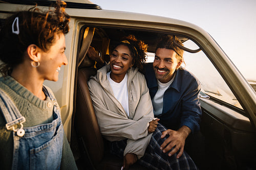 Three friends in a van on a roadtrip