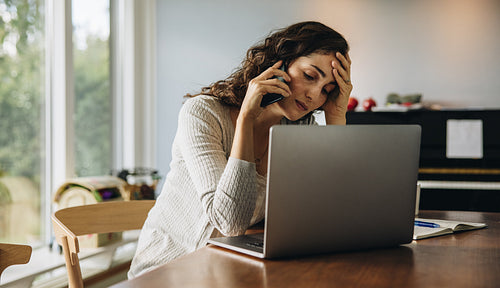 Woman feeling tired while working from home