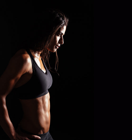 Confident fitness woman in sports clothing