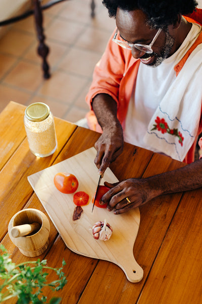 Healthy traditional Brazilian breakfast preparation with mature man in the kitchen