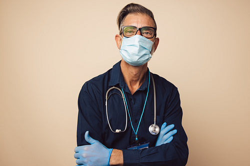 Portrait of a male doctor on protective mask and gloves