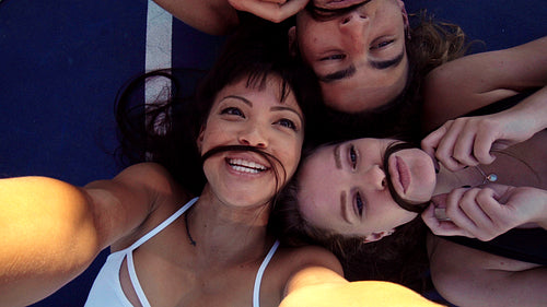 Friends taking fun selfies together