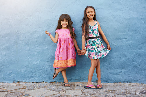 Two little girls standing together