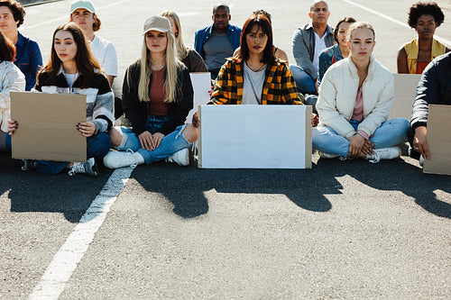 Group of young people holding blank signs during peaceful protest demonstration
