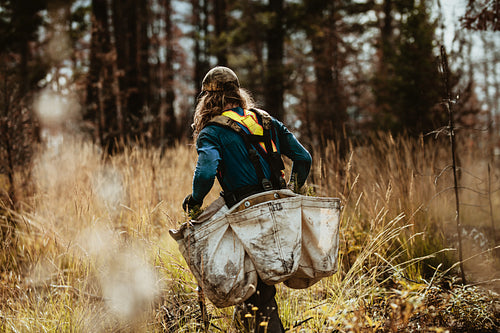 Planter planting trees in deforested land