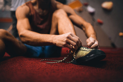 Man wearing wall climbing shoes