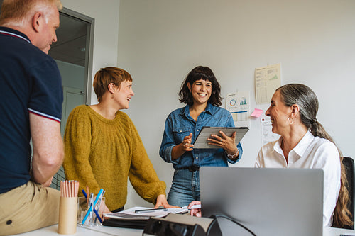 Entrepreneurs in office discussing new strategy