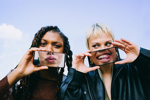 Funny phone trick: two friends playing with face effects