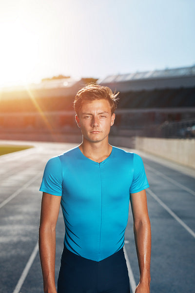 Young man after run on stadium race track