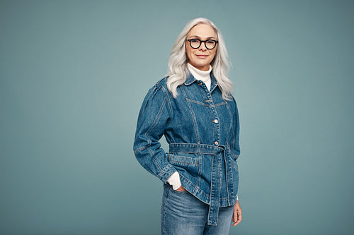Mature woman feeling empowered in a studio