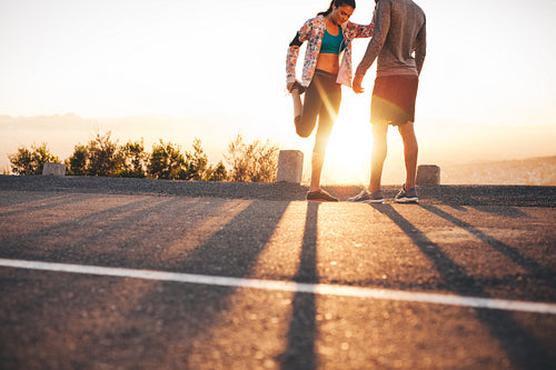 Joggers stretching before a run