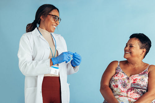 Doctor with senior woman in clinic