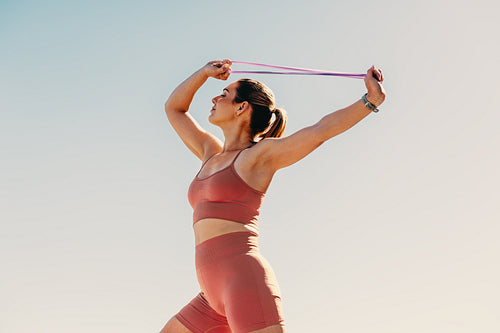 Woman in sportswear doing pilates to increase physical strength and mental wellbeing