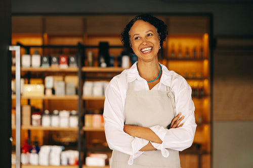 Successful small business owner smiling happily