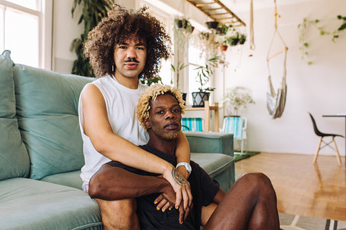 LGBTQ+ couple embracing each other at home