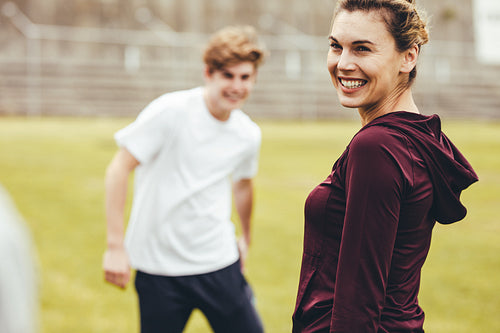 Teacher conducting an exercising class in high school