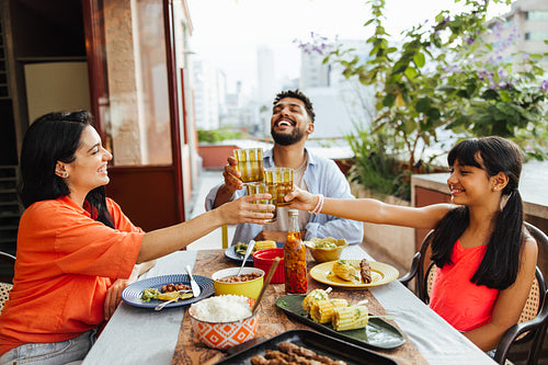 Family enjoying a fun and festive meal together outdoors