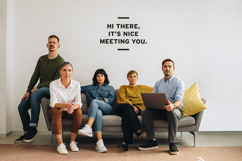 Business team sitting at office lobby