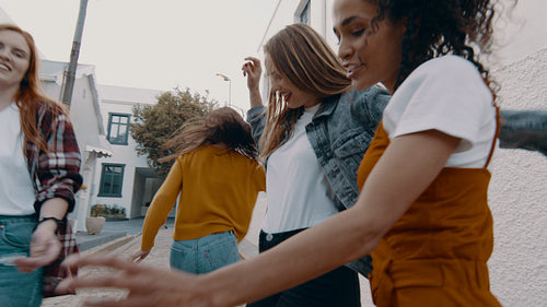 Girls singing and dancing on the street