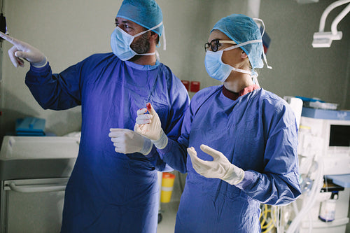 Surgeon looking at medical monitor during surgery