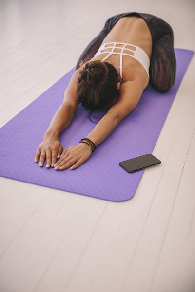 Fitness female performing yoga