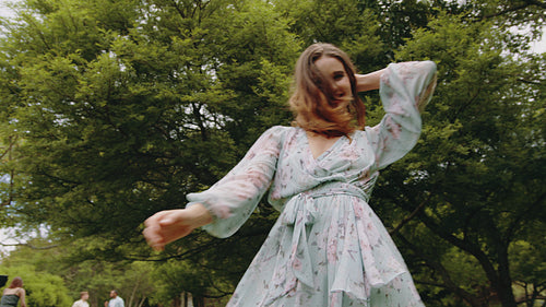 Pretty woman dancing outdoors